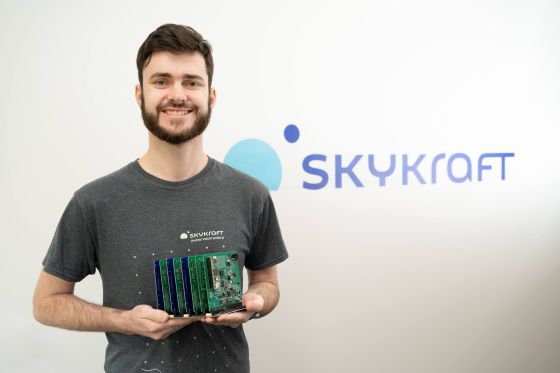 Andrew Gibbs with a backplane containing Skyride cards.
