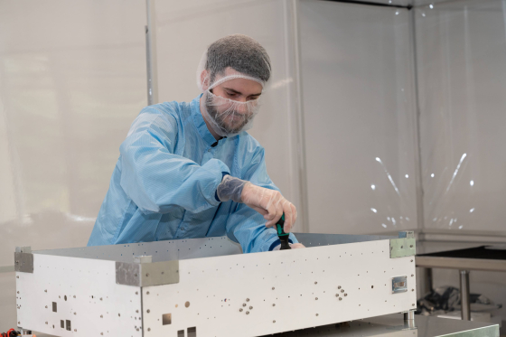 Andrew Gibbs working one of the satellites that Skykraft will launch later this year. 