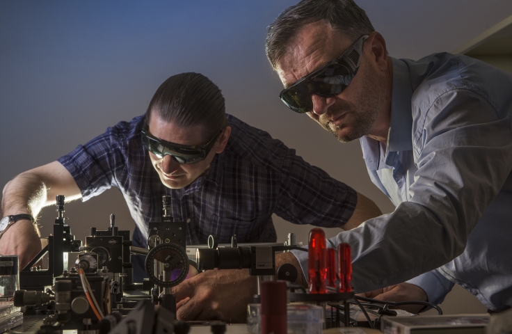 Professor Andrey Miroshnichenko, from UNSW Canberra, and Dr Vladlen Shvedov from the Australian National University photographed in a laser lab at UNSW Canberra.