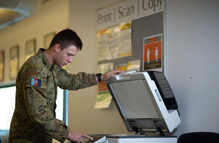 Cadet operating a printer